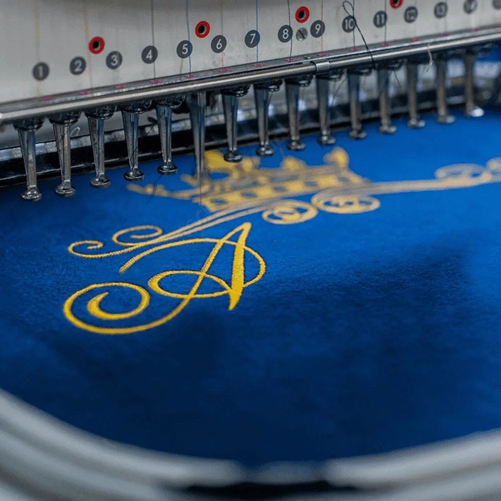 Embroidered logo on garment, finished sample