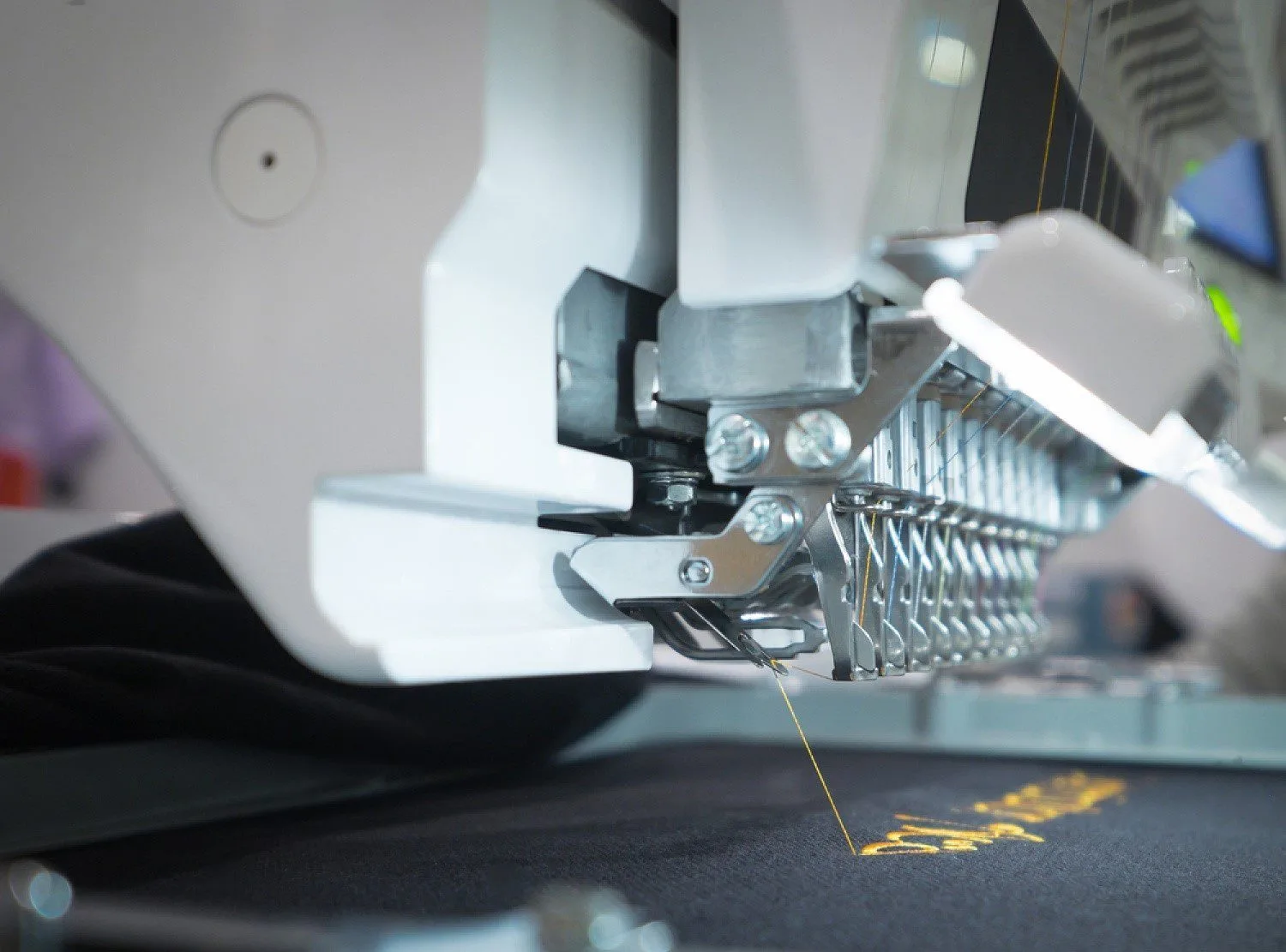 Close-up of an embroidery machine in operation