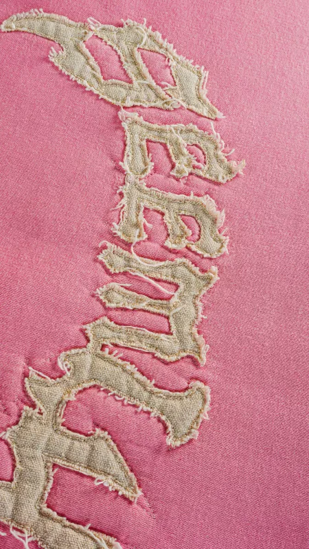 Appliqué embroidery sample with fabric-piece inlay